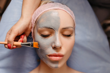 Spa Mud Mask. Woman in Spa Salon. Face Mask. Facial Clay Mask. Treatment