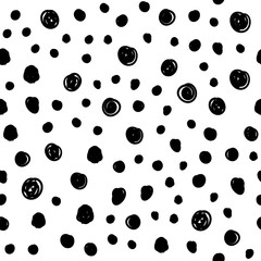 Dot doodles seamless pattern. Hand drawn circles texture background.