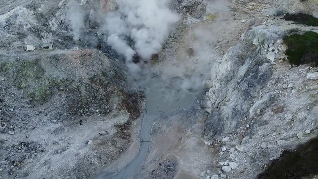 Aerial shot zoom out of Volcanic Activity Boiling Geothermal Mud