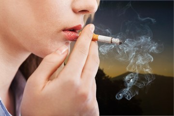 Obraz premium Human hand holds cigarettes, bad habits concept