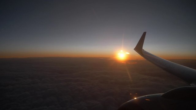 View at sunset over clounds form an airplane