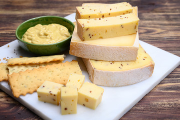 Belgian cheeses from abbey made from cow milk with monks beer, fenugreek and mustard seeds