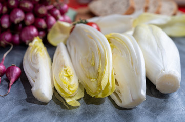 Fresh Belgian endive or chicory bitter salad ready to cook or eat
