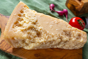 One piece of authentic Parmigiano-Reggiano or Parmesan Italian hard, granular cheese