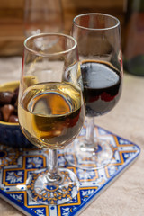 Fortified wine from Andalusia, Spain, different types of sherry in glasses and olives, colors of Andalusisa