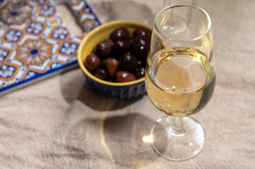 Fortified wine from Andalusia, Spain, different types of sherry in glasses and olives, colors of Andalusisa