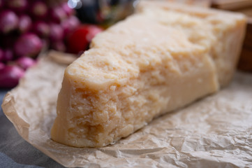 One piece of authentic Parmigiano-Reggiano or Parmesan Italian hard, granular cheese