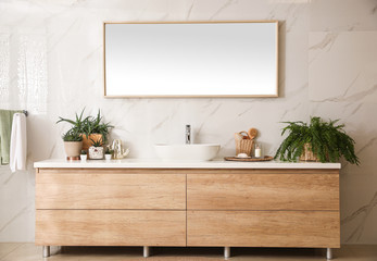 Fototapeta premium Stylish bathroom interior with countertop, mirror and houseplants. Design idea