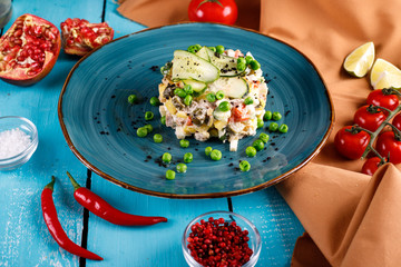 Olivier salad in a plate on the table