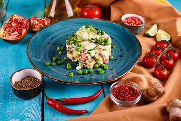 Olivier salad in a plate on the table