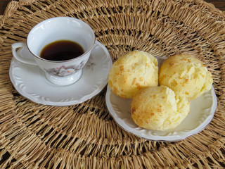Yummy coffee in the cup and cheese bread.