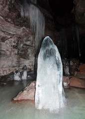 USA, California, Modoc County, Lava Beds National Monument. A large stalactite growing from the...