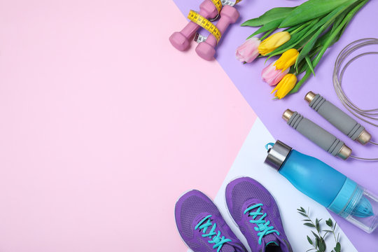 Flat Lay Composition With Spring Flowers And Sports Items On Color Background. Space For Text