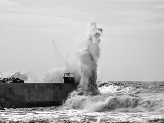 Lighthouse hit by waves in Tuscany