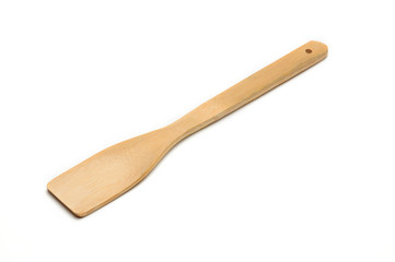Wooden spatula from kitchen utensils on a white background