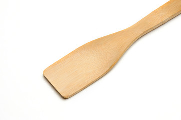 Wooden spatula from kitchen utensils on a white background