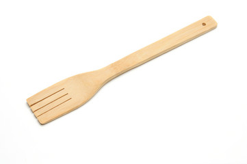 Wooden fork from kitchen utensils on a white background