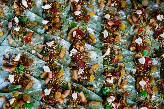 High angle close up of betel nuts wrapped in leaves on a street market.,Yangon