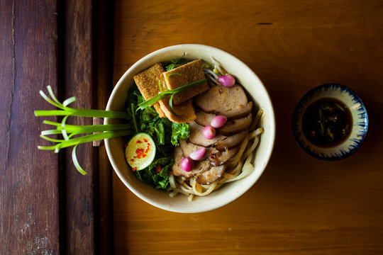 High angle close up of bowl of Cao lau noodles, a specialty dish with noodles made from local well water in Hoi An, Vietnam. ,Hoi An