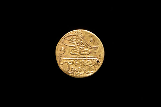 Old Ottoman Empire Gold Coin With A Hole, Obverse. Isolated On Black Background