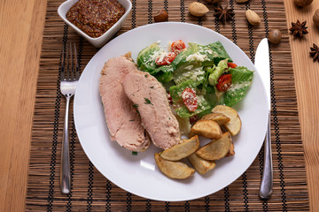 Fried piece of turkey meat with onions