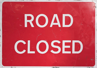 UK red and white ROAD CLOSED sign shot close up straight on.