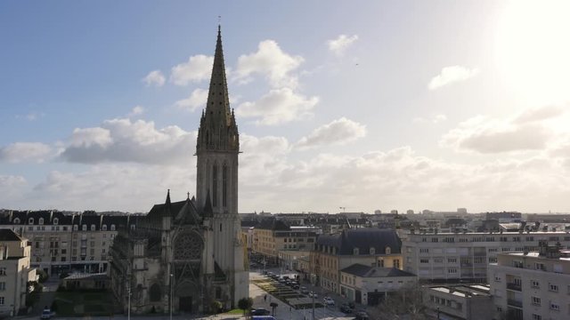 Caen, city of Normandy, France. Filmed in the winter. View on a church located in the old town. Time lapse. Some clouds in the sky.
