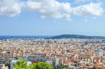 Fototapeta premium View of Spain's Barcelona from the Hill of Three Crosses in Guel Park on the Mediterranean Sea, New Town and Montjuic Mountain
