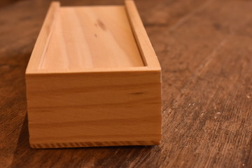 wooden case with dominoes