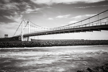 Beautiful cold winter landscape of Jokulsarlon glacier lagoon, Iceland, in the winter with the bridge as a background, vintage black and white