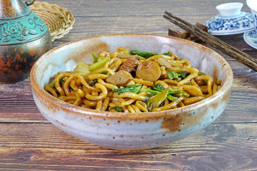 Fujian stir fried noodles or Hokkien Mee is a traditional noodle dish brought to Phuket by immigrants from the Fujian province of China, one of most popular food in Phuket Thailand. Selective focus.