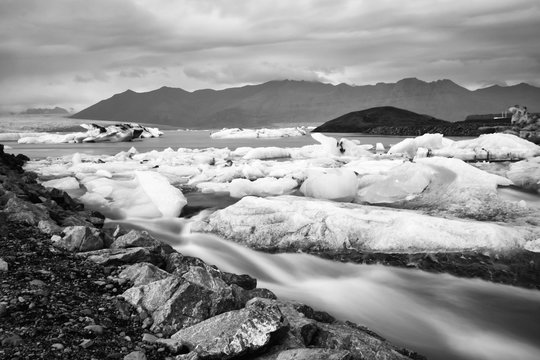 Jokulsarlon glacier lagoon in Iceland. Long exposure shot makes the water and the sky silky. Long exposure, glacier, moody concepts, black and white vintage