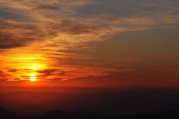 Fototapeta na wymiar Orange sunset sky background with clouds
