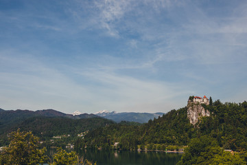 Fototapeta na wymiar Panorama of bled castle with alps in the background.