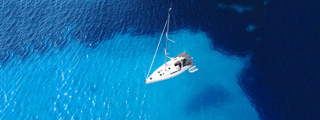 Aerial drone ultra wide photo of breathtaking turquoise exotic bay of blue lagoon in island of...