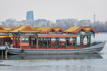 Fototapeta na wymiar Tourist boats on Kunming Lake in Summer Palace in Beijing, capital city of China
