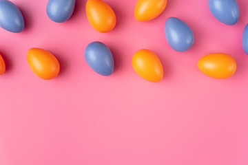 Fototapeta na wymiar Colorful Easter Eggs on bright pink background