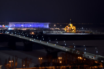 Fototapeta na wymiar View of the stadium and the beautiful Orthodox Church. Nizhny Novgorod. Russia
