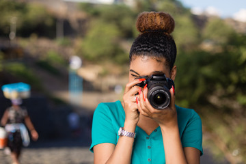 African American woman  photographer taking outdoor photos -  Black people