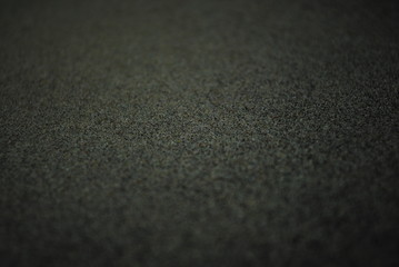 Crystals of kief leftover on black trim tray backdrop after medical marijuana/cannabis harvest