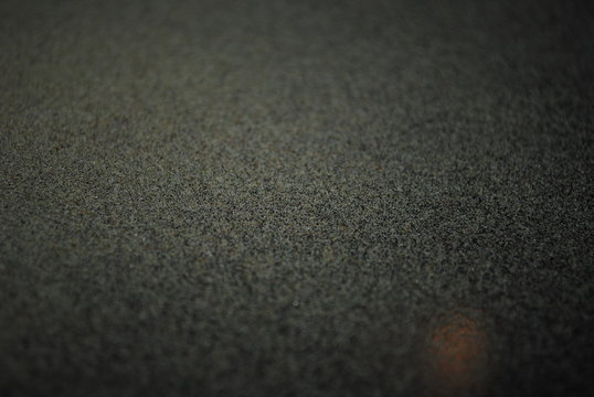 Crystals of kief leftover on black trim tray backdrop after medical marijuana/cannabis harvest