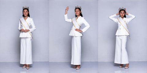 Full length Snap Figure, Asian Business Woman Transgender wears White Suit pants black hair and Miss Beauty Queen Contest put crown sash on, studio lighting gray background isolated collage group