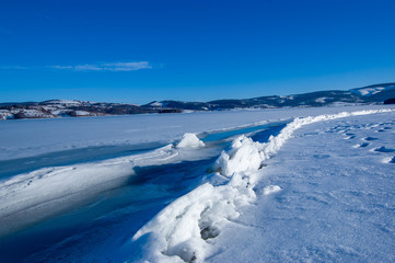 Fototapeta na wymiar Frozen lake and surroundings