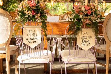 Wedding Setup. Banquet with table and chairs. Decoration, flowers, ware, glass