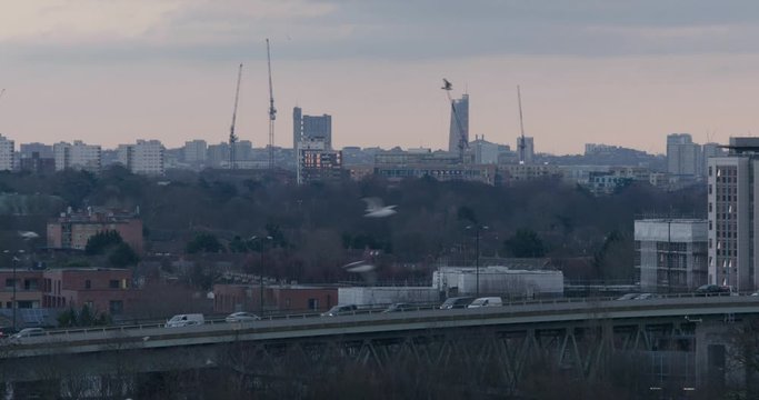 Hounslow, UK - January 10 2020: Buildings in west London including the Trellick Tower with the M4 motorway on a raised flyover closer to the camera