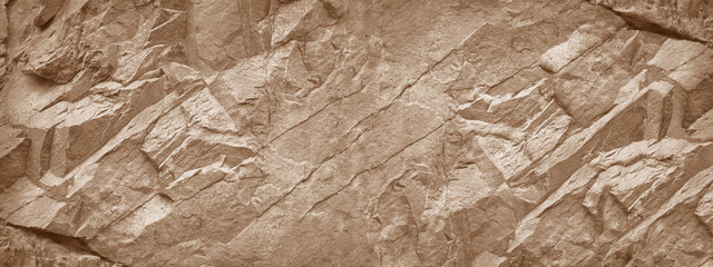 Stone wall. Light brown rock texture. Stone grunge backdrop. Rocky texture background with copy...