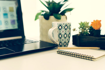 Blank white copyspace with on marble desk work space white tone color texture.