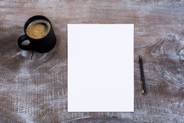 Blank paper sheet mockup with cofee mug