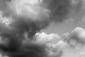Storm clouds up close during summer in black and white abstract