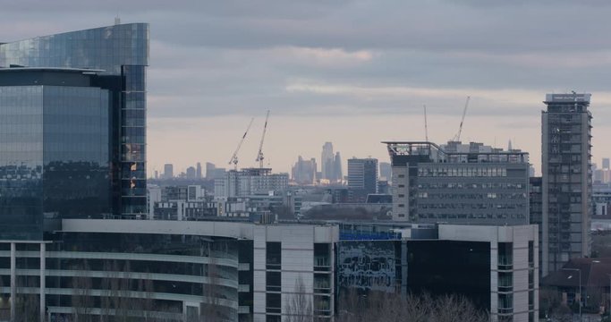 Hounslow, UK - January 10 2020: Buildings in west London with the distance skyline of the City of London on a winter afternoon